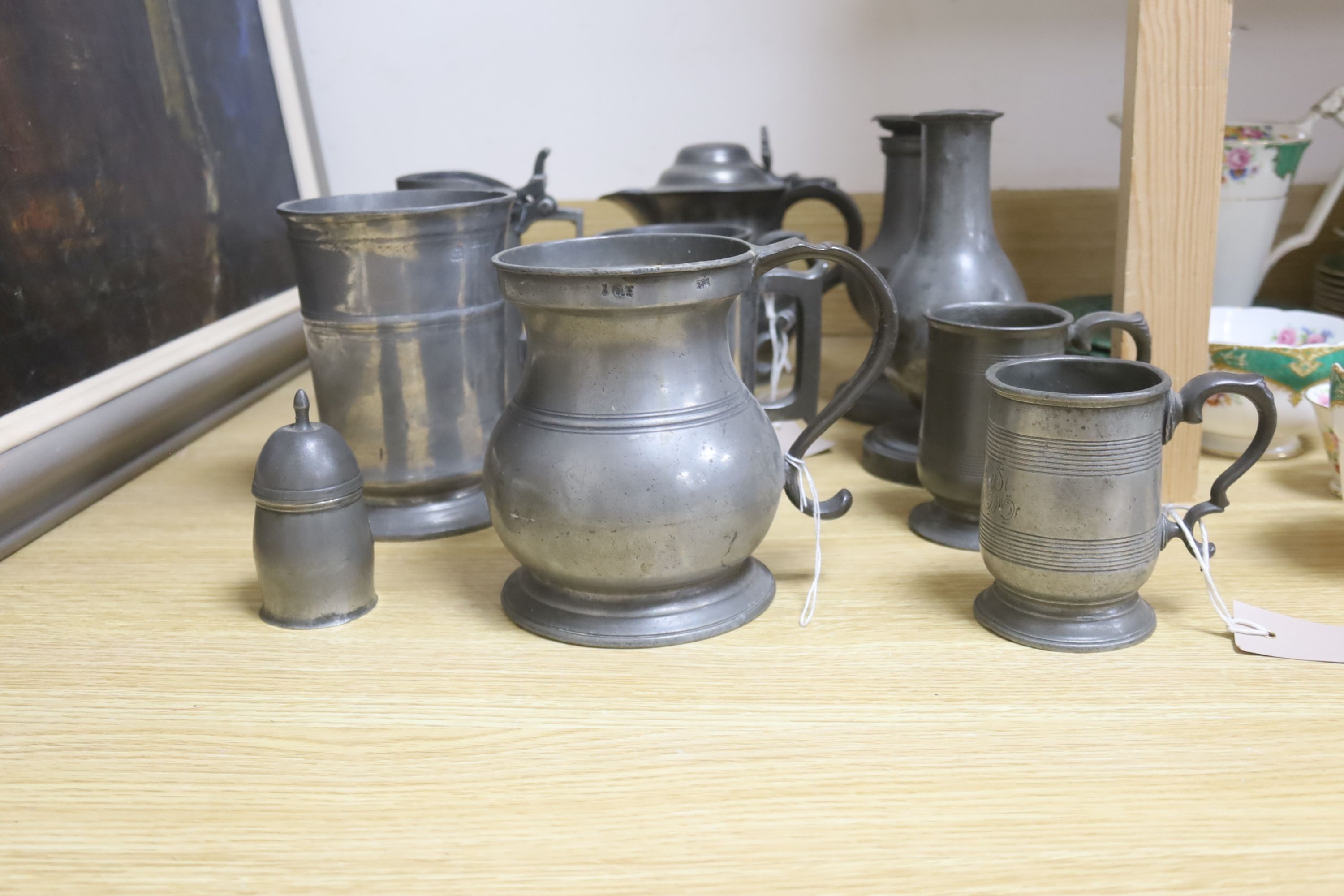 A group of 19th century French and British pewter mugs, measures and other vessels etc.